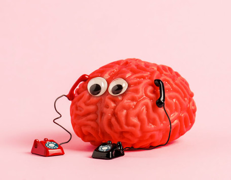 human brain model with two retro phones on pink ba 2023 11 27 05 33 55 utc 2