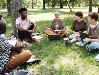 teacher with students studying outdoors 2025 02 11 15 46 19 utc re