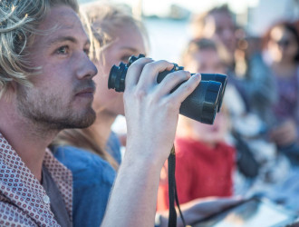 young tourist couple with binoculars on boat trip 2024 10 18 08 37 04 utc