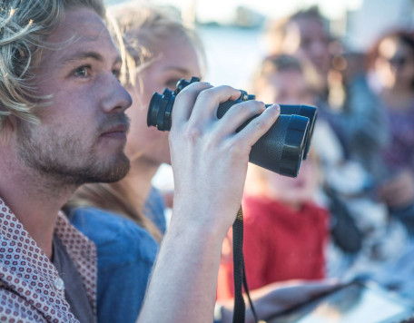 young tourist couple with binoculars on boat trip 2024 10 18 08 37 04 utc